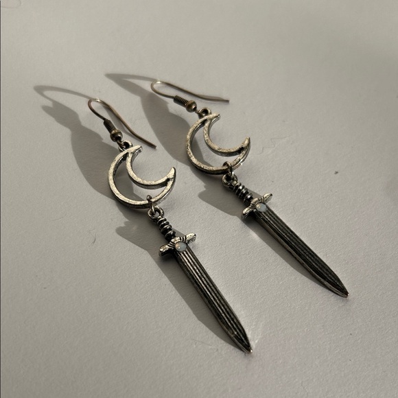 Jewelry - Silver tone Crescent moon and Sword drop Earrings with faux moonstone